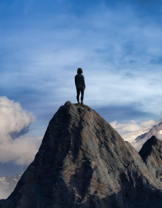 Adventurous Adult Female Hiker on top of Rocky Mountain with hands open. 3D Rendering Peak. Sunset Sky. Aerial Background from British Columbia, Canada. Adventure Sport Concept